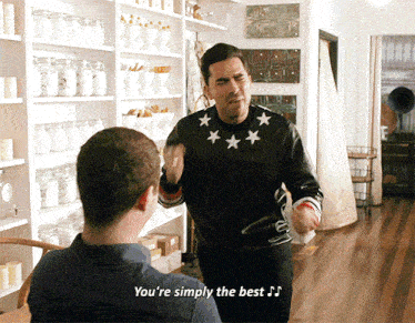 a man says you 're simply the best while another man watches