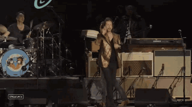 a stage with a hohner keyboard in the back