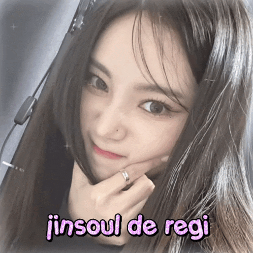 a girl with a ring on her finger and the words jinsoul de regi