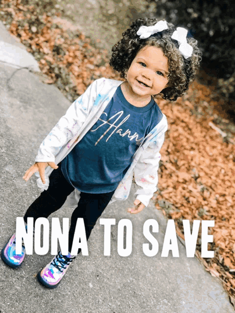 a little girl is wearing a shirt that says hanna on it