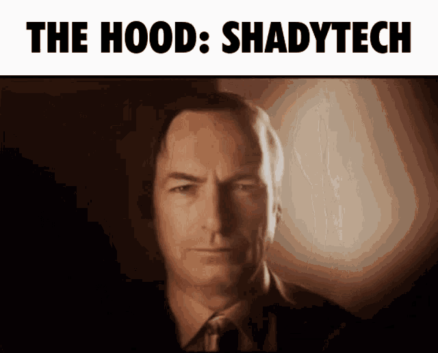 a man in a suit and tie with the words shadytech above him