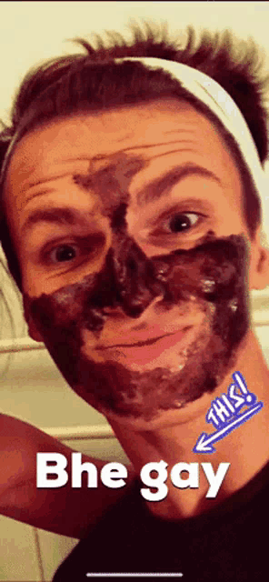 a man with a black mask on his face has the word bhe gay written below him