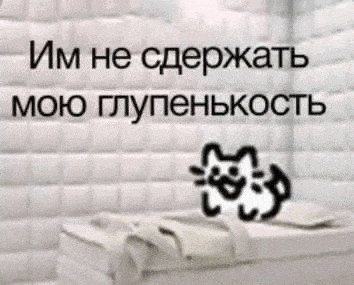 a picture of a bed with a cat on it in a room with a white wall behind it .