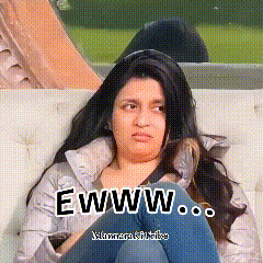 a woman is sitting on a couch with her legs crossed and the words ewww written above her