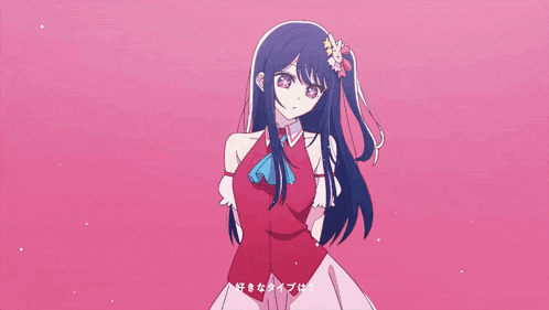 a girl in a red dress with a flower in her hair is standing next to a pink heart