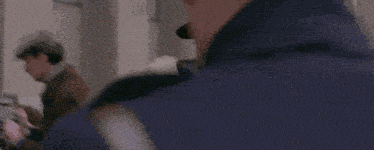 a man wearing a top hat and gloves is talking on a cell phone