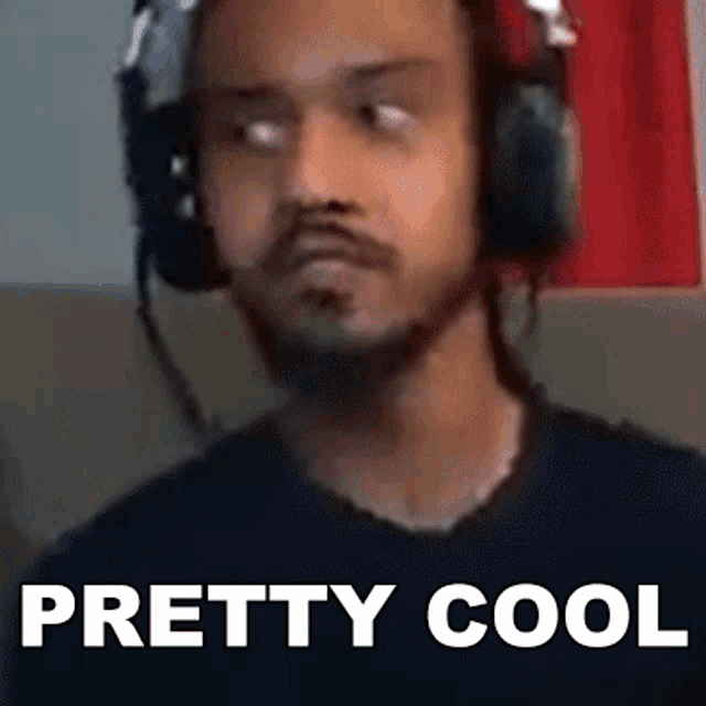 a man wearing headphones and a black shirt with the words pretty cool below him