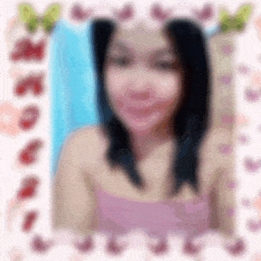 a blurry picture of a girl in a pink top with a butterfly border