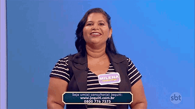 a woman wearing a name tag that says milena