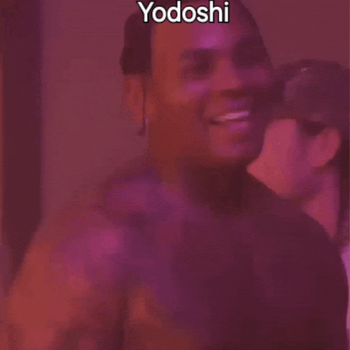 a man is sticking his tongue out in front of a purple background and the word yodoshi is on the bottom .
