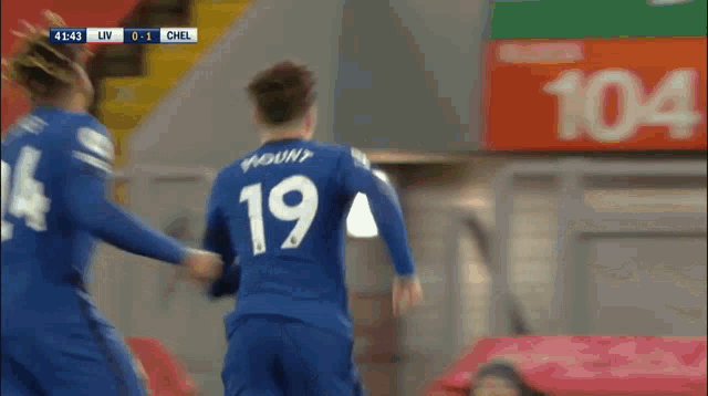 a soccer player in a blue uniform with the number 3 on it