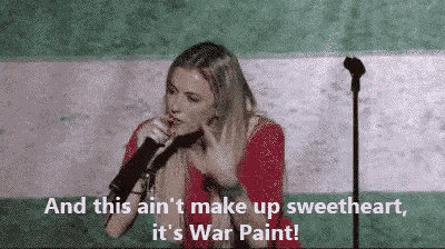 a woman singing into a microphone with the words and this ain 't make up sweetheart