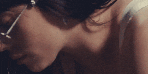 a close up of a woman wearing glasses