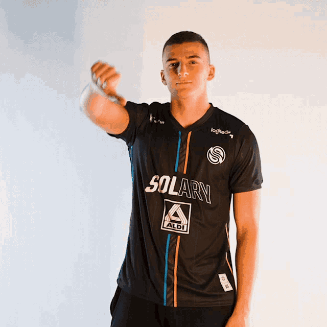 a man wearing a black shirt with solary on it