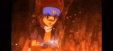 a boy in a blue hat is holding a purple object in his hand .