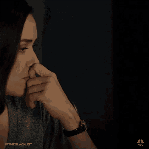 a close up of a woman 's face with the hashtag #theblacklist on the bottom