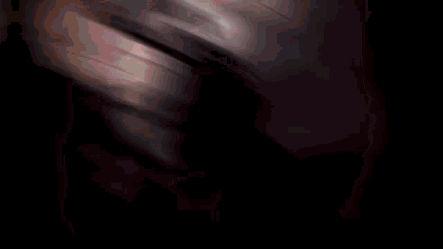 a blurred image of a person 's face with a red and white background