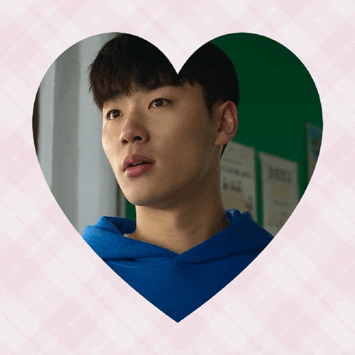 a man in a blue hoodie is in a heart