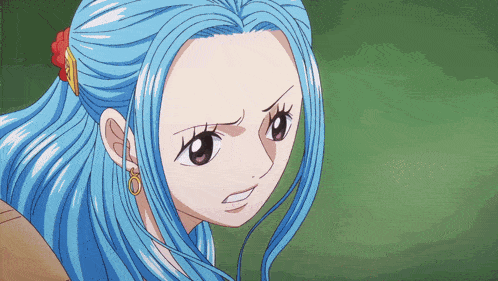 a girl with blue hair and earrings looks angry