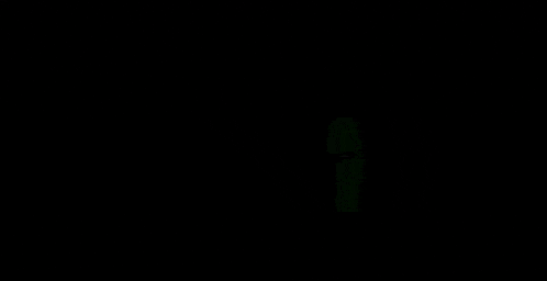 a group of skeletons are standing next to each other in the dark .