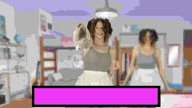 a pixelated image of a woman holding a pair of socks in a room
