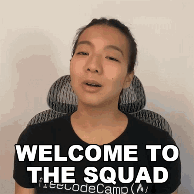 a woman wearing a black shirt that says welcome to the squad on it