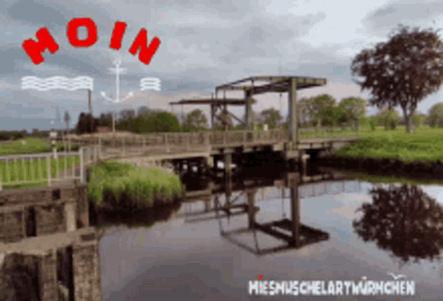 a bridge over a body of water with the word moin written in red
