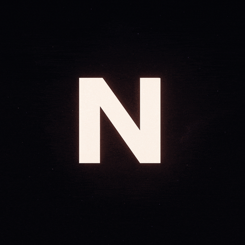the letter n is glowing in the dark against a black background