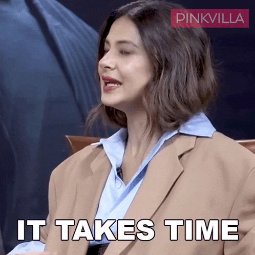 a woman sitting in a chair with the words " it takes time " above her