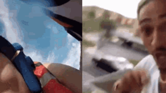 a man is riding a parachute and a woman is sitting in a car .