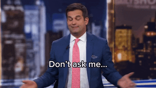 a man in a suit and pink tie says " don 't ask me "
