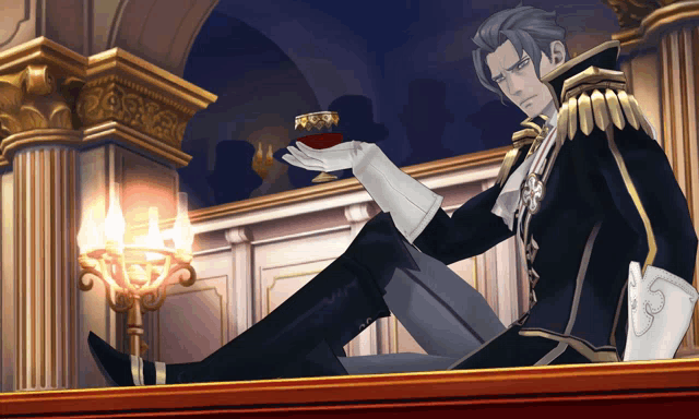 a man sits on a balcony holding a cup of wine