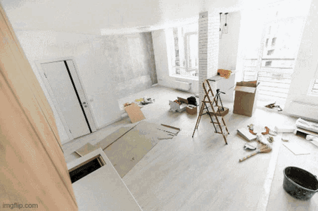 a room that is being remodeled with a bucket and a ladder on the floor