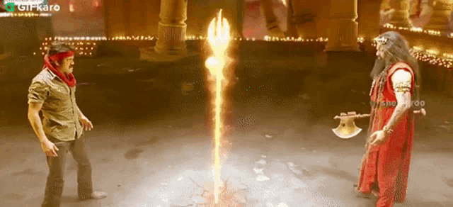 two men are standing next to each other in front of a fire coming out of the ground and the words girkaro are on the bottom