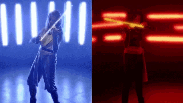 a woman is playing a violin in a dark room next to a person holding a light saber .