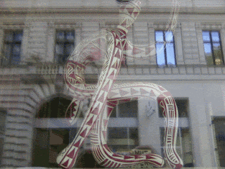 a red and white snake with a geometric pattern on it