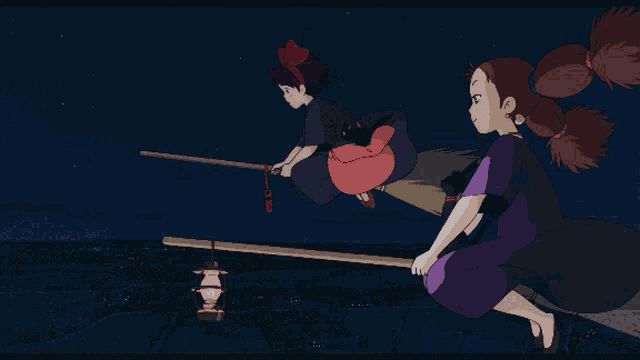 two witches are flying on a broom with a lantern hanging from it