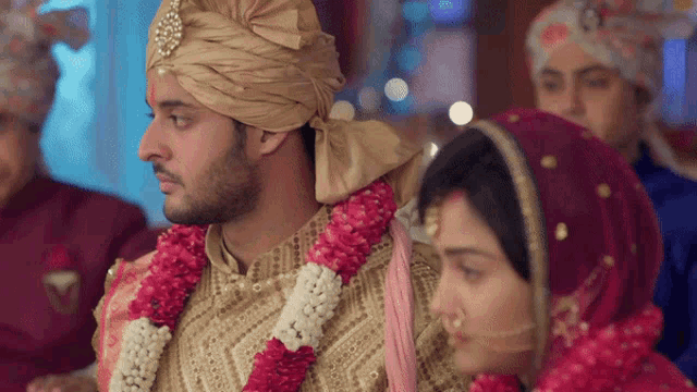 a bride and groom are standing next to each other at their wedding ceremony