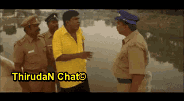 a group of police officers are talking to a man in a yellow shirt who is standing in front of a body of water .