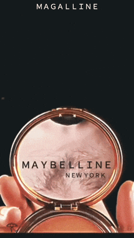 a woman is holding a maybelline new york powder