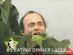 a man is eating a green leaf with the words `` us eating dinner later '' .