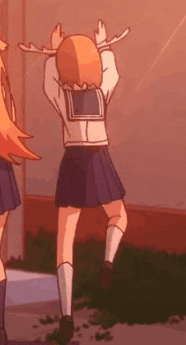a cartoon girl in a school uniform is dancing in front of a building .
