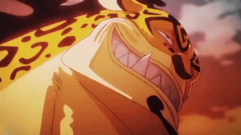 a close up of a leopard 's face with sharp teeth and a leopard print .
