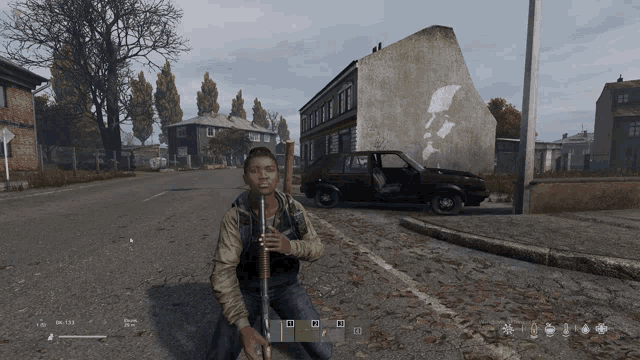 a screenshot of a video game shows a man kneeling down with a gun in his hand