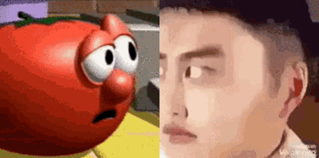 a tomato with a sad face is next to a man with a hat .