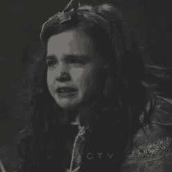 a little girl is crying in a black and white photo with ctv written on the bottom