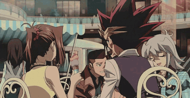 a group of anime characters sitting around a table