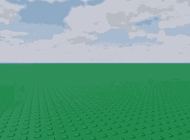 a large black cube is in the middle of a field of green bricks