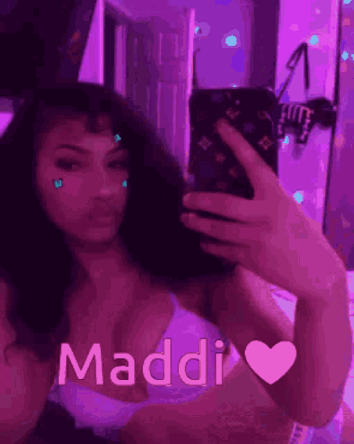 a woman taking a selfie with the name maddi written on the bottom