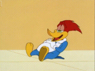 woody woodpecker is sitting on the floor with his arms outstretched and smiling .